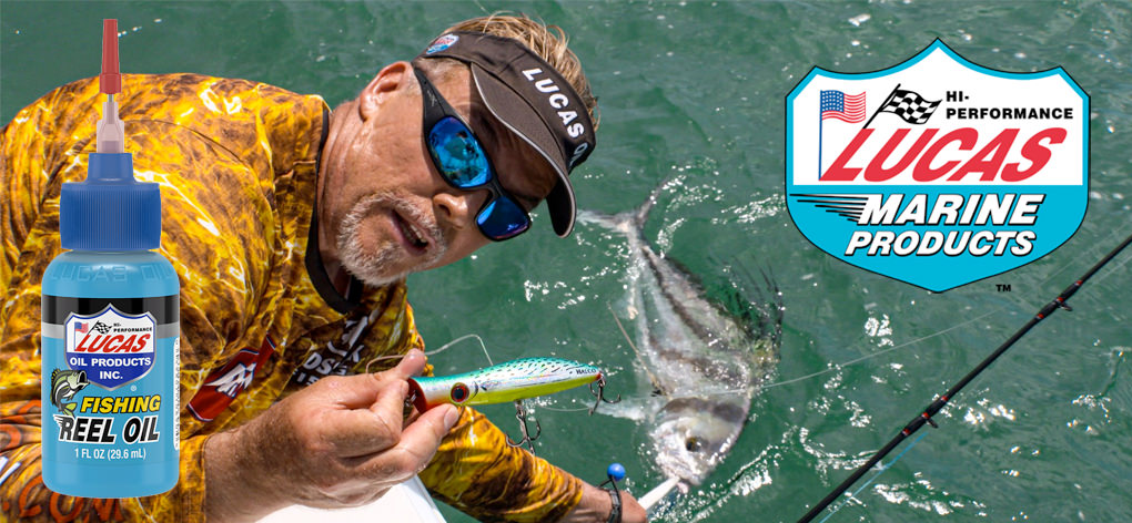 A bottle of Lucas Fishing Reel Oil and a Lucas Oil Marine logo overlay a photo of Mark Davis, wearing a Lucas Oil visor, holding a lure in one hand and a fish in the other.