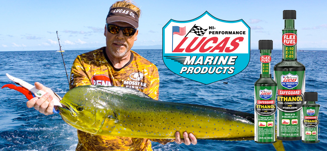 Bottles of Lucas Safeguard Ethanol Fuel Conditioner and the Lucas Oil Marine logo overlaying a photo of Mark Davis, wearing a Lucas Oil visor,  holding a mahi mahi.